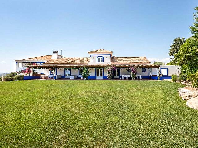 A happy family home boasting lovely gardens and 2 swimming pools